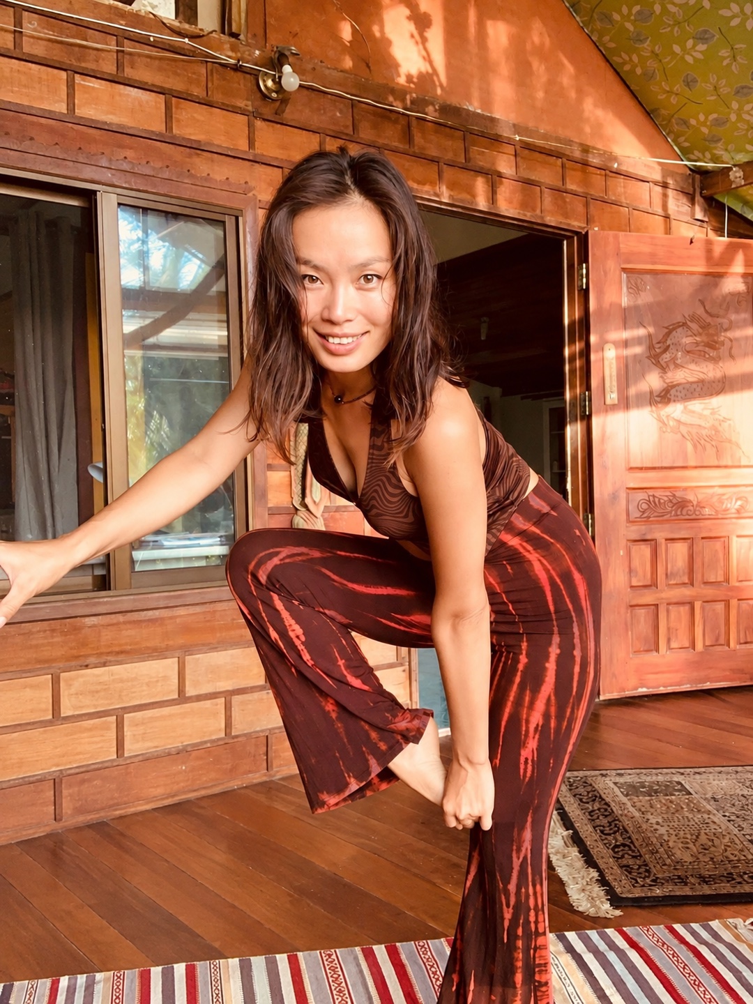 Zola Purevsuren smiling in a warm wooden room